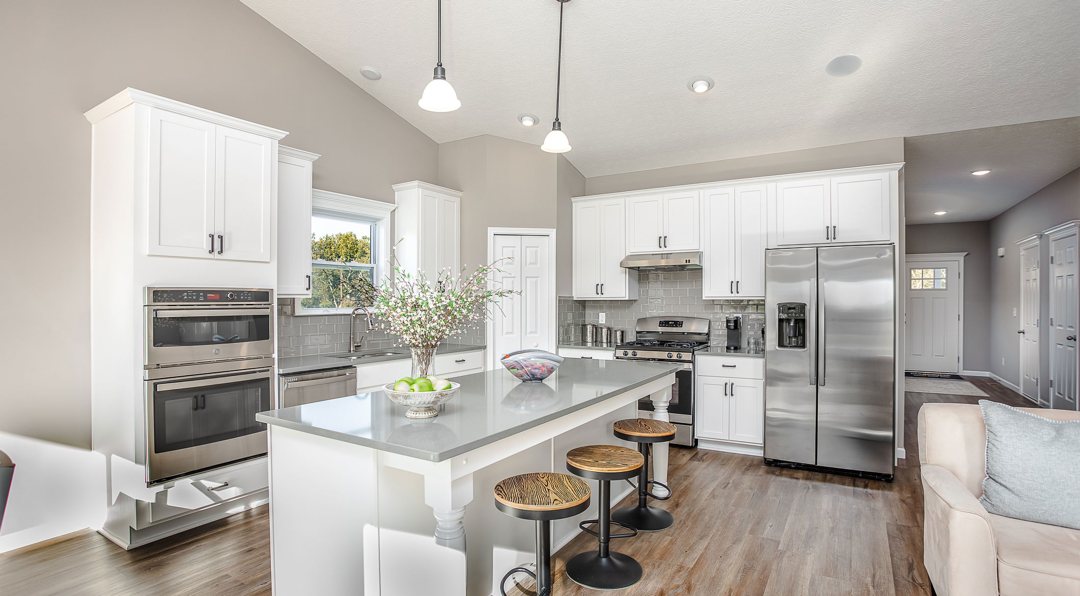 white kitchen with stainless appliances in a new ranch home in butler, pa
