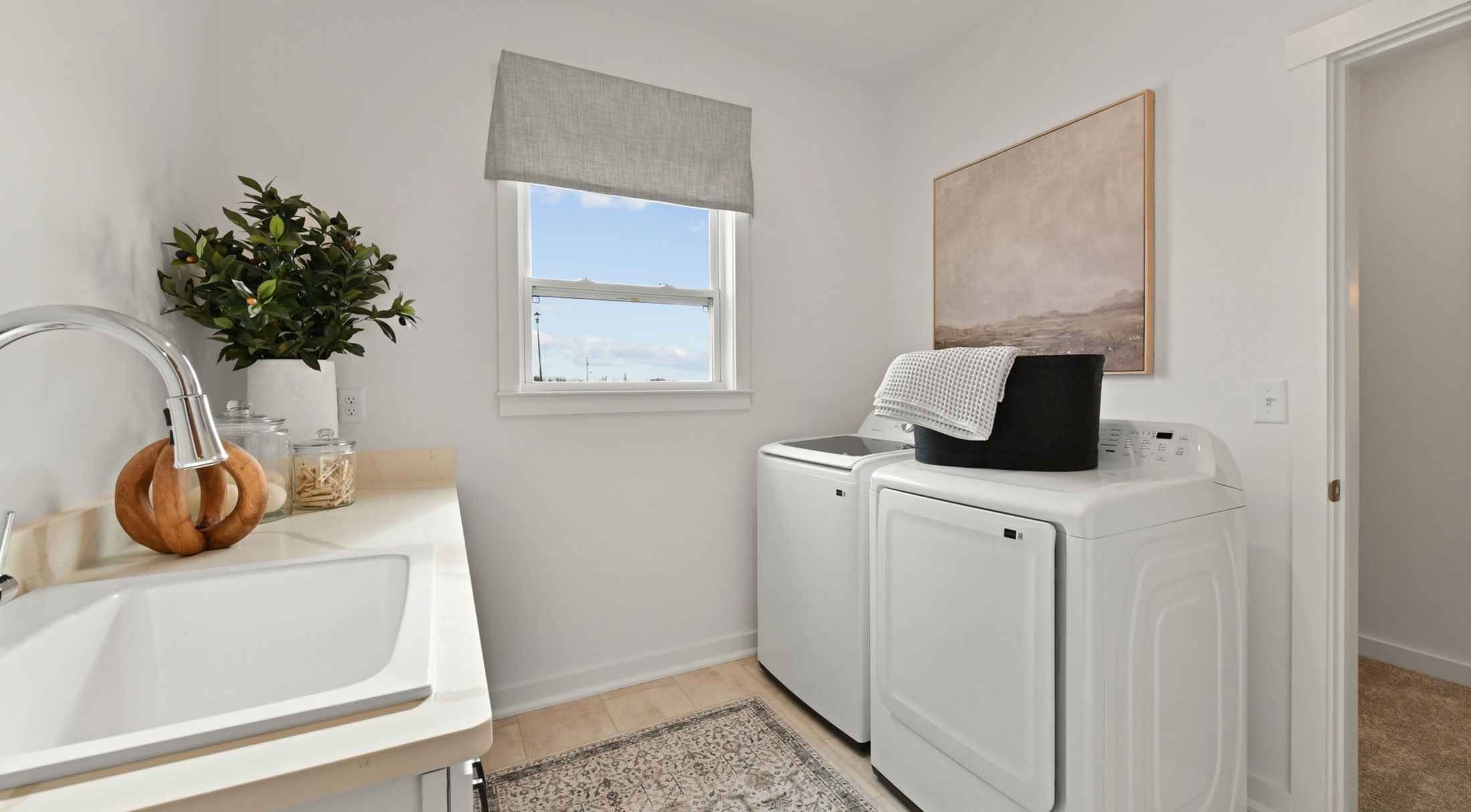 finished laundry room in a new home in butler