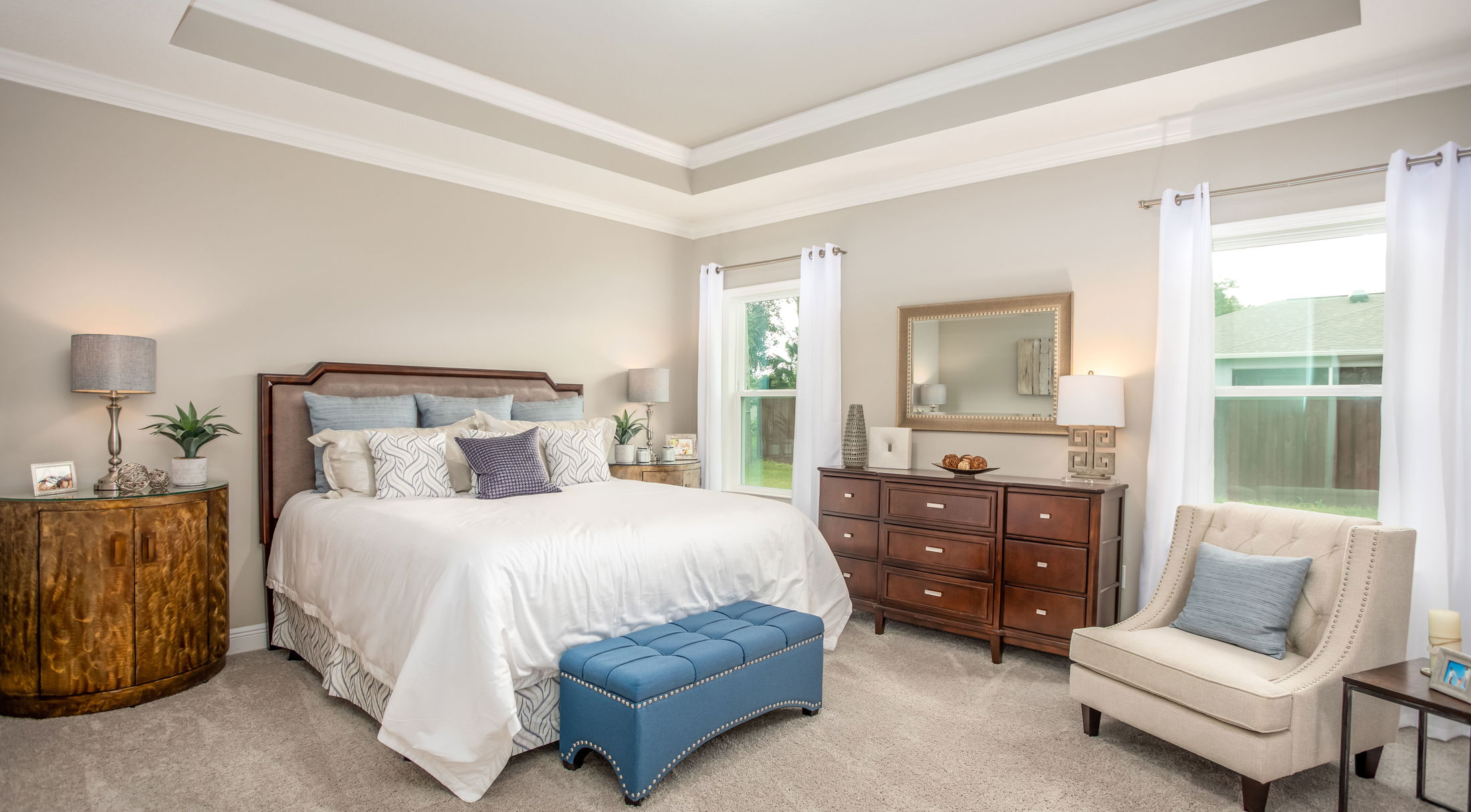Luxurious modern bedroom with elegant decor, featuring a cozy bed, stylish furniture, and soft natural lighting.