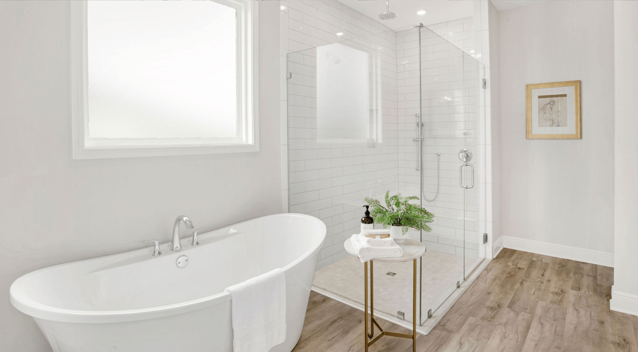 soaking tub and walk-in shower in the master bathroom of a new home in grant-valkaria, fl
