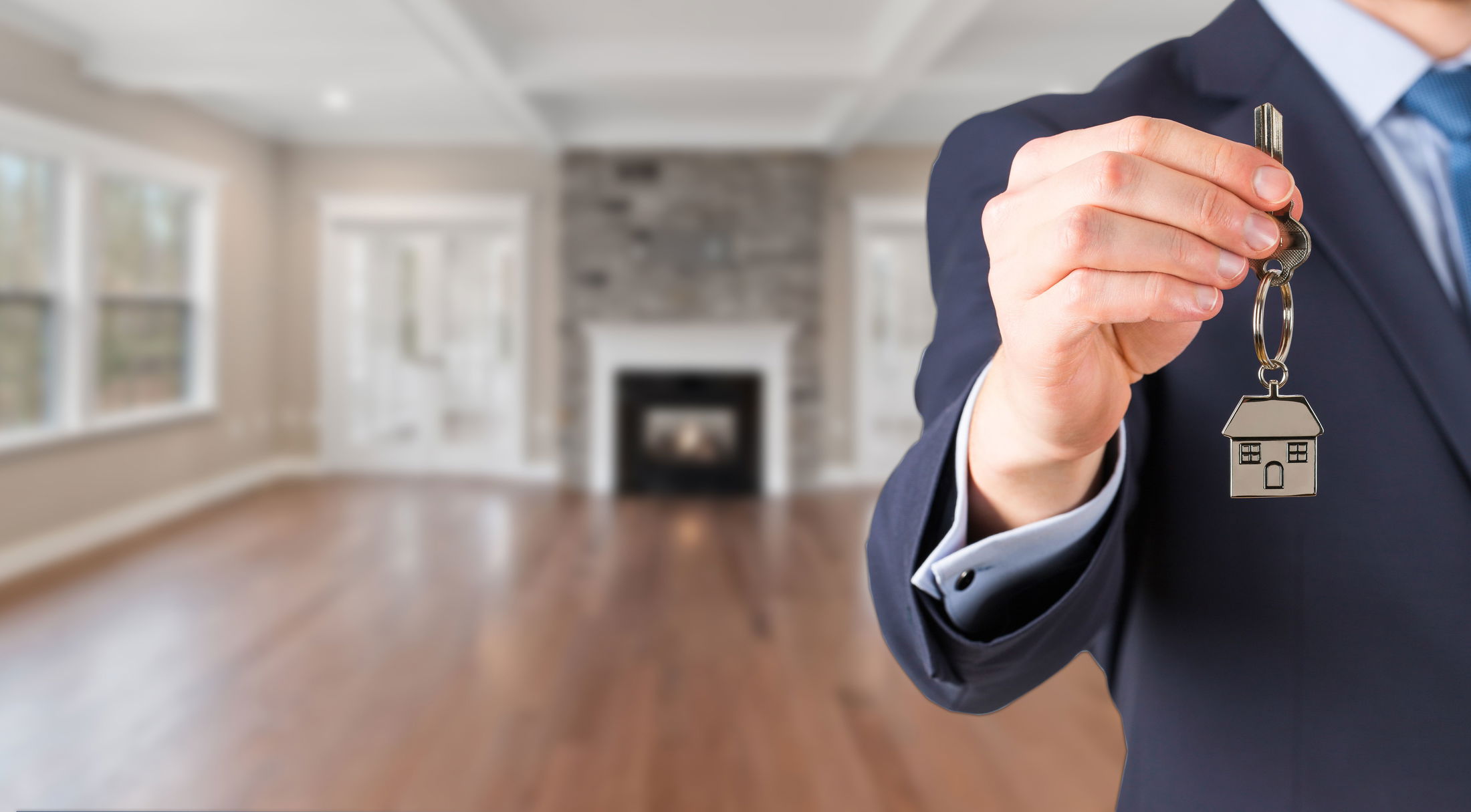 real estate agent holding keys in an empty home in alachua, fl