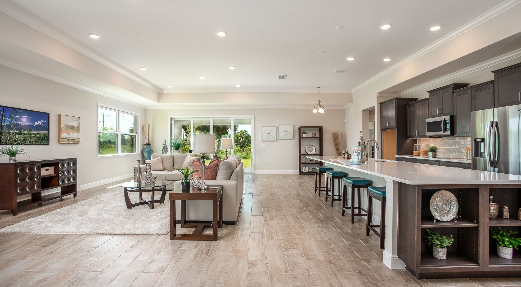 open floor plan kitchen into livingroom of a new home in naples, fl