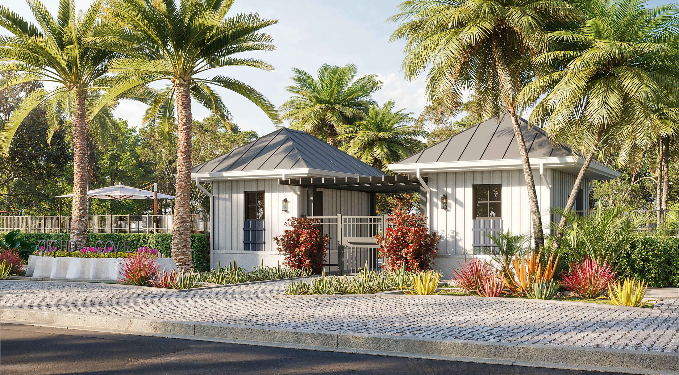 Tropical residential entrance with modern architecture and lush palm trees at Orchid Cove.
