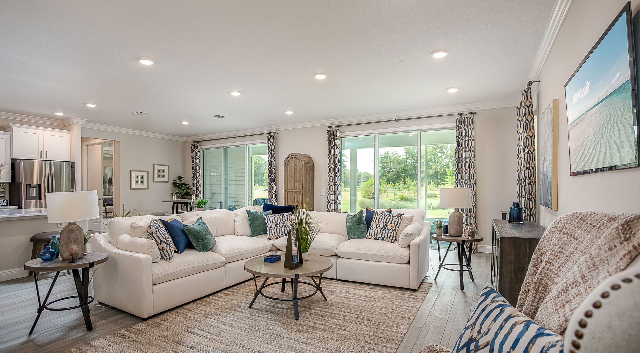 open floor plan view from neutral living room to kitchen