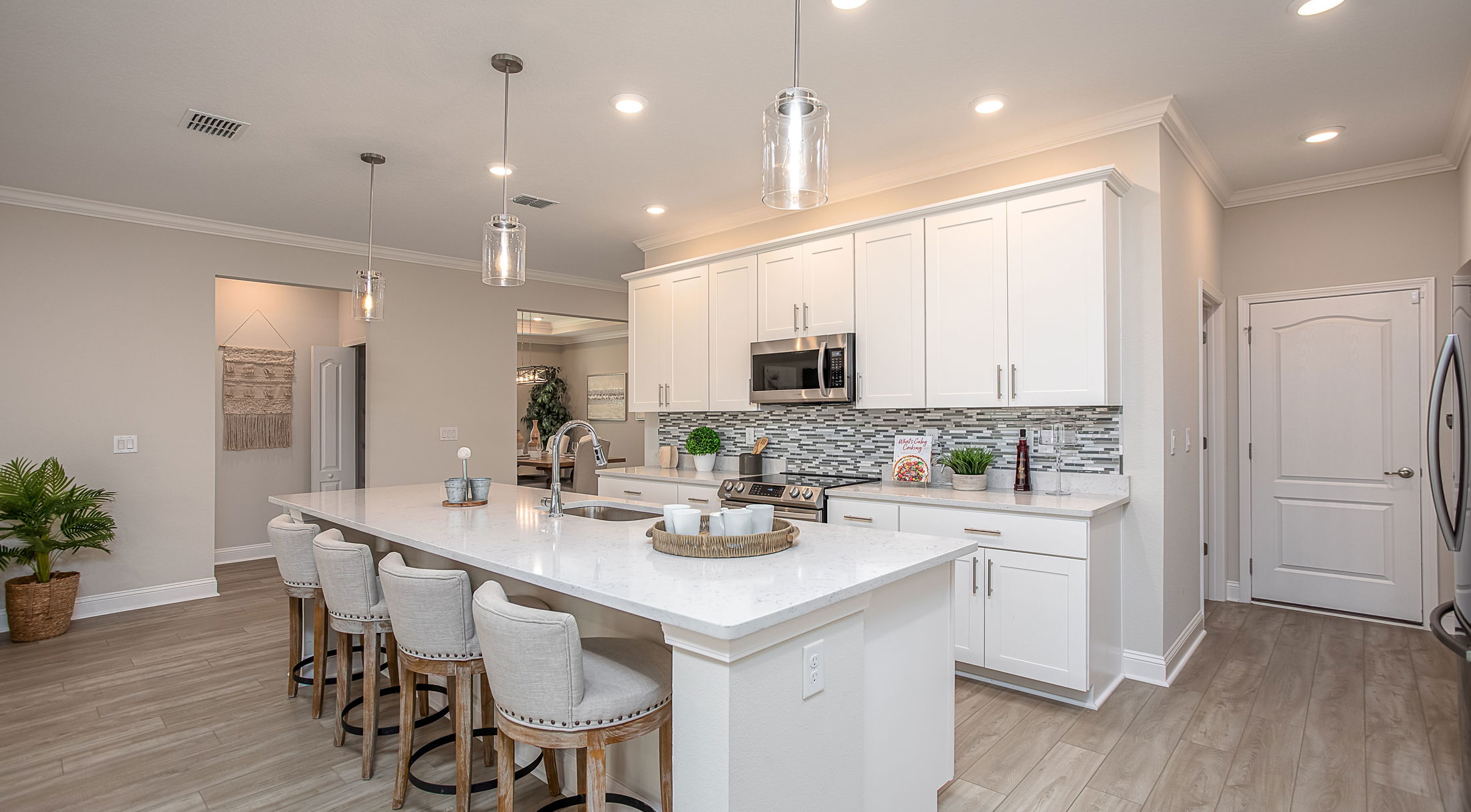 white kitchen with quartz countertops in a new home in st. marys, ga