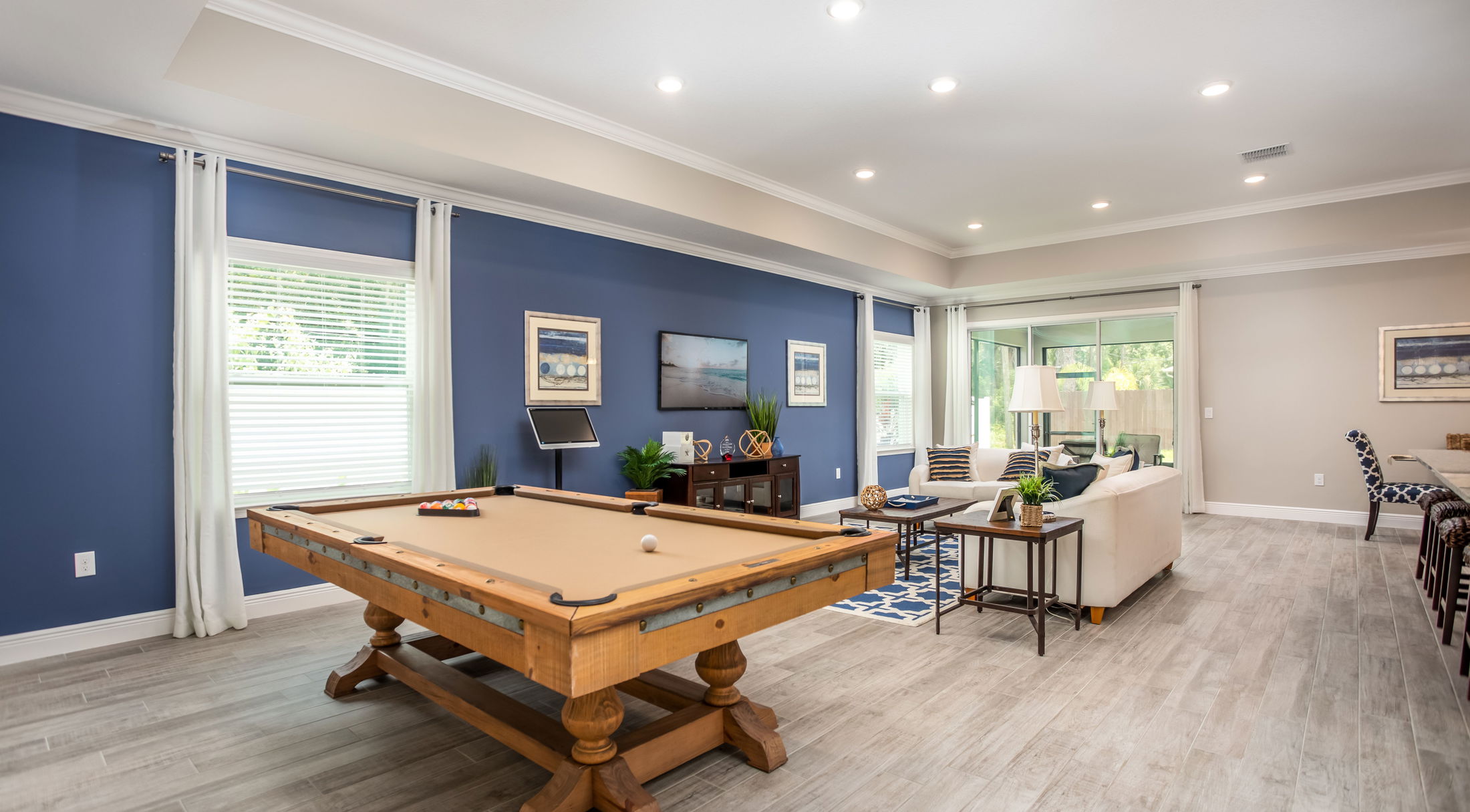 pool table next to living room in a new home in pensacola, fl