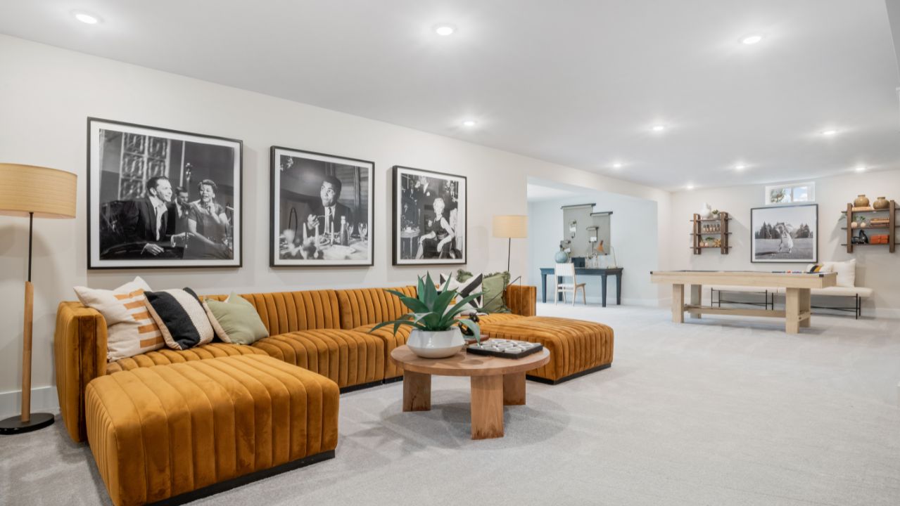 finished basement with seating area and game area of a new home in winchester, va