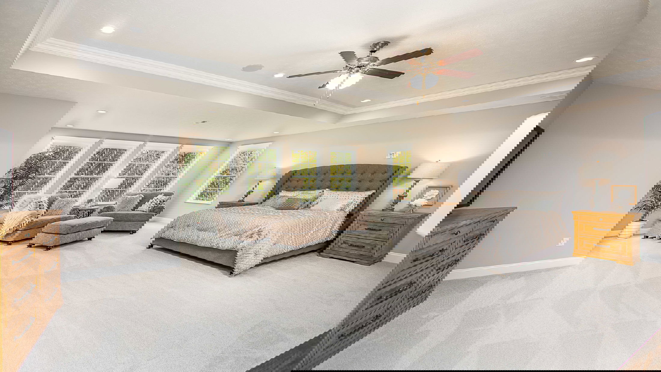 Glitched image of a vibrant landscape with multicolored horizontal stripes and abstract shapes.