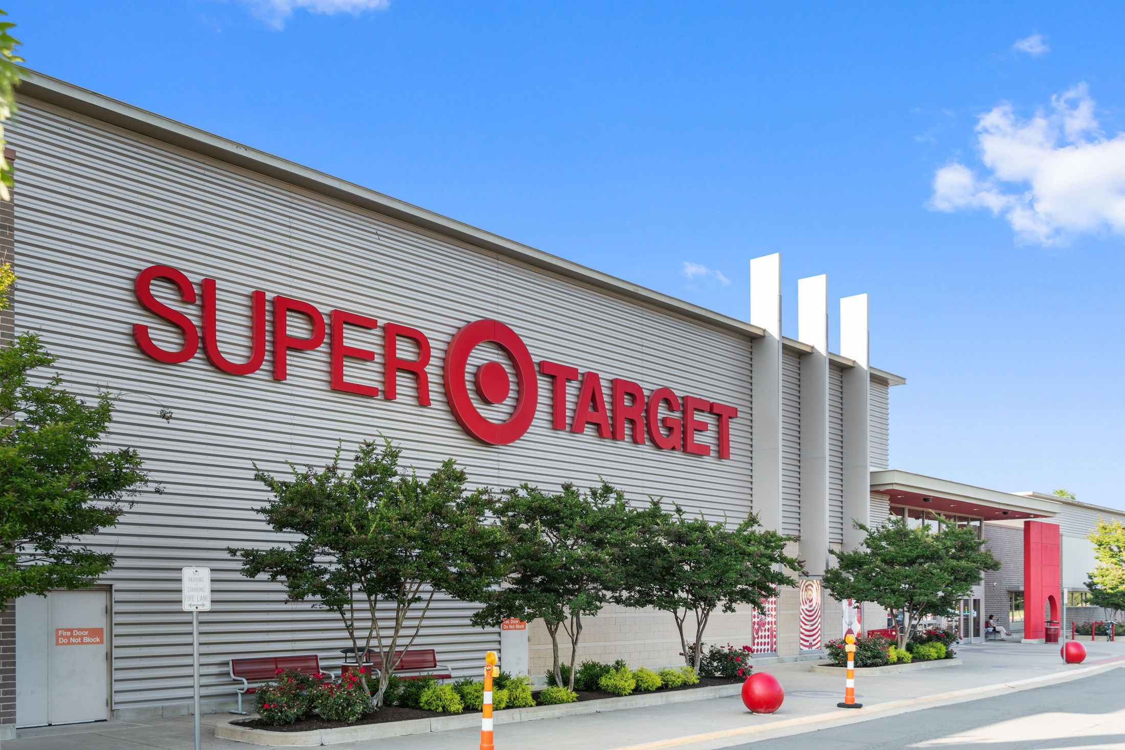 Exterior view of a Super Target store with prominent red branding and modern architectural design.
