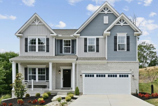 Beautiful modern two-story house with gray siding, white trim, and a spacious front porch.