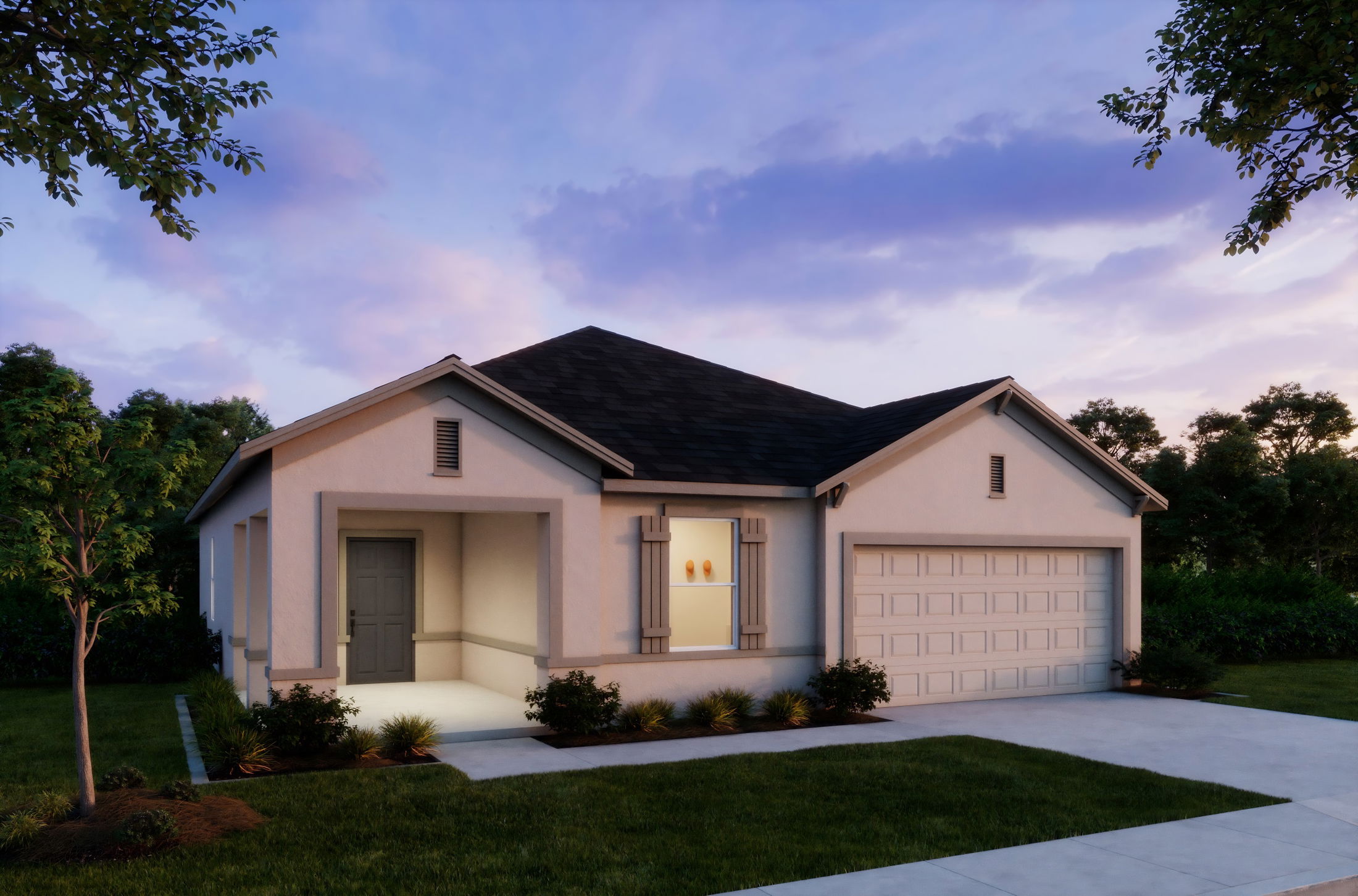 Modern single-story suburban home with well-maintained garden and garage at sunset.