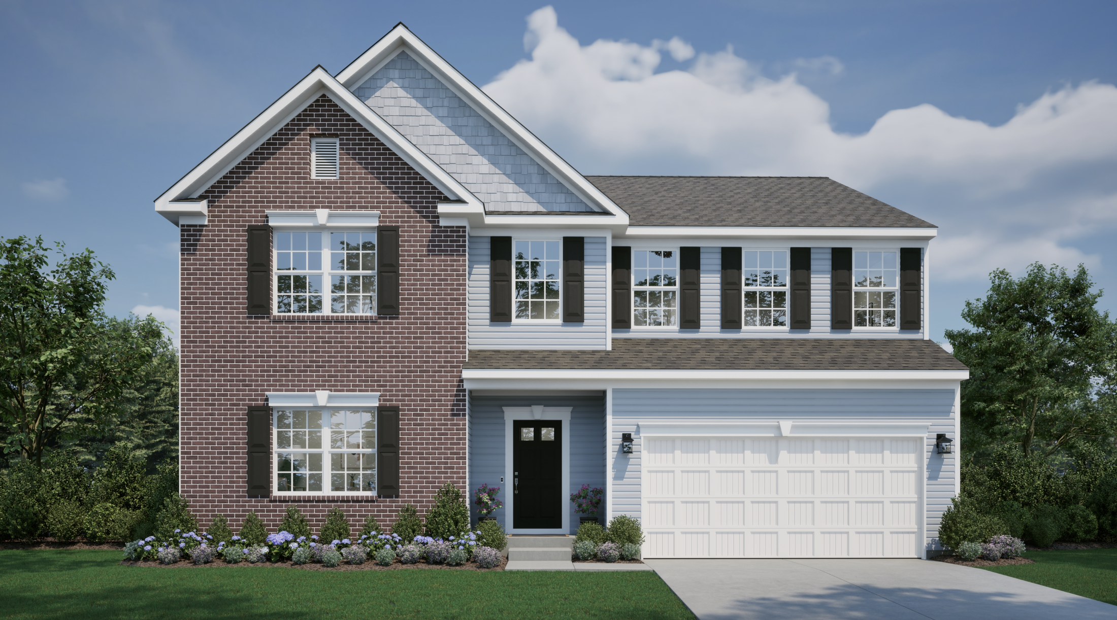A charming two-story suburban house with brick and siding exterior, featuring a landscaped front yard and double garage against a clear blue sky.