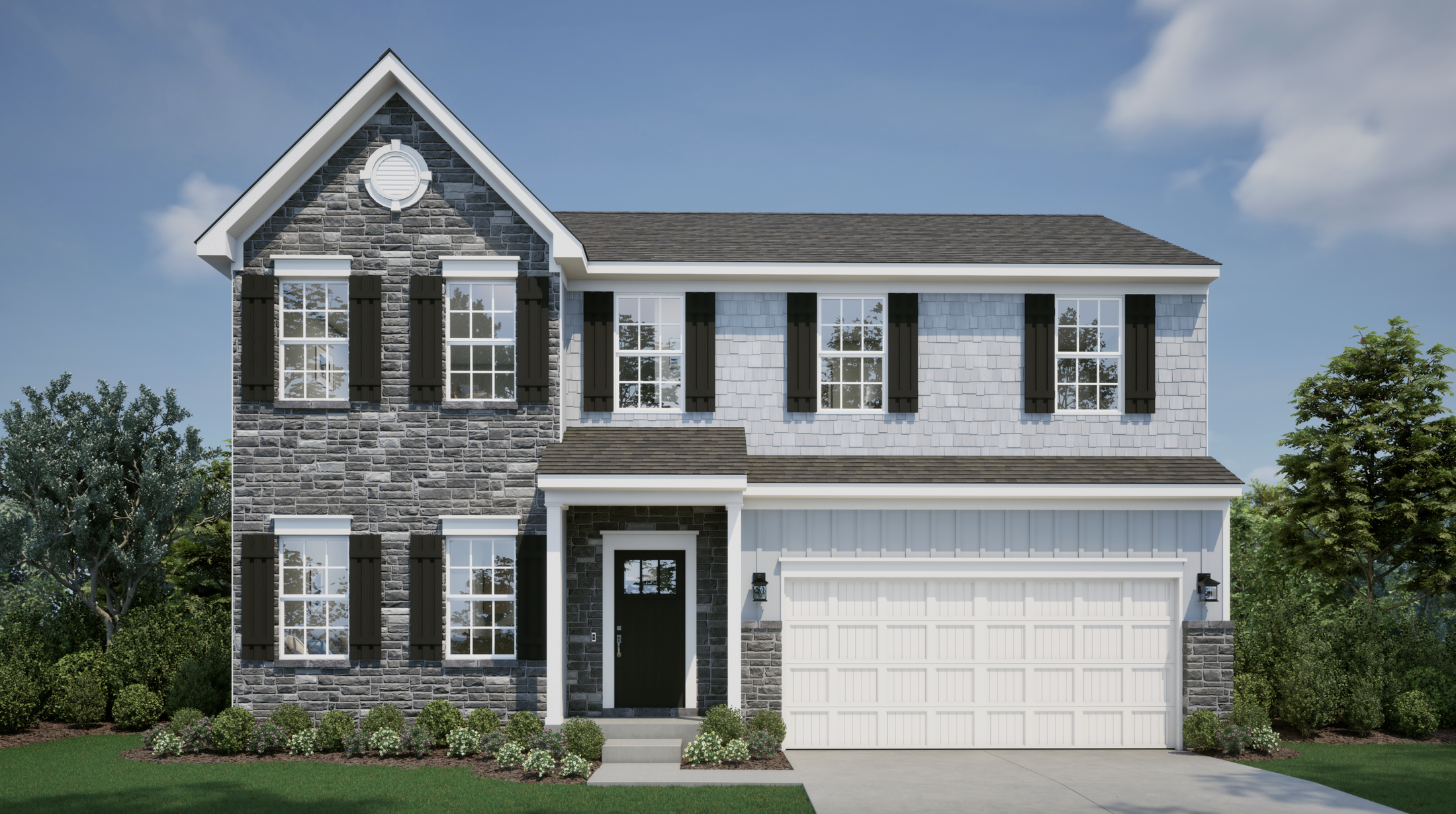 A two-story suburban house with a stone and shingle exterior, black shutters, and a white garage, surrounded by landscaped greenery under a clear blue sky.