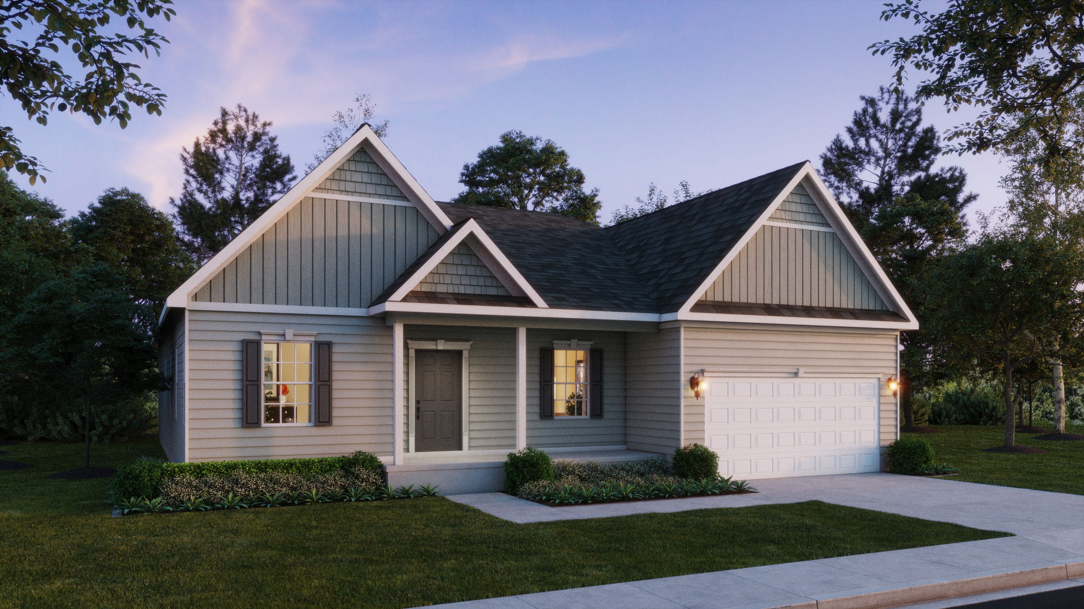 Charming single-story house with gray siding, front porch, and a two-car garage surrounded by lush greenery at dusk.