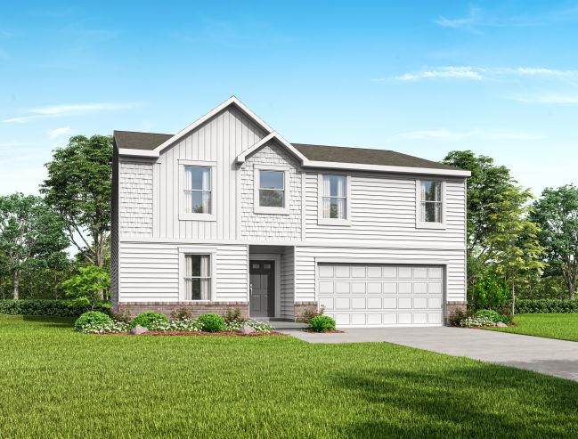 Modern two-story white house with attached garage and well-maintained lawn under a clear blue sky.