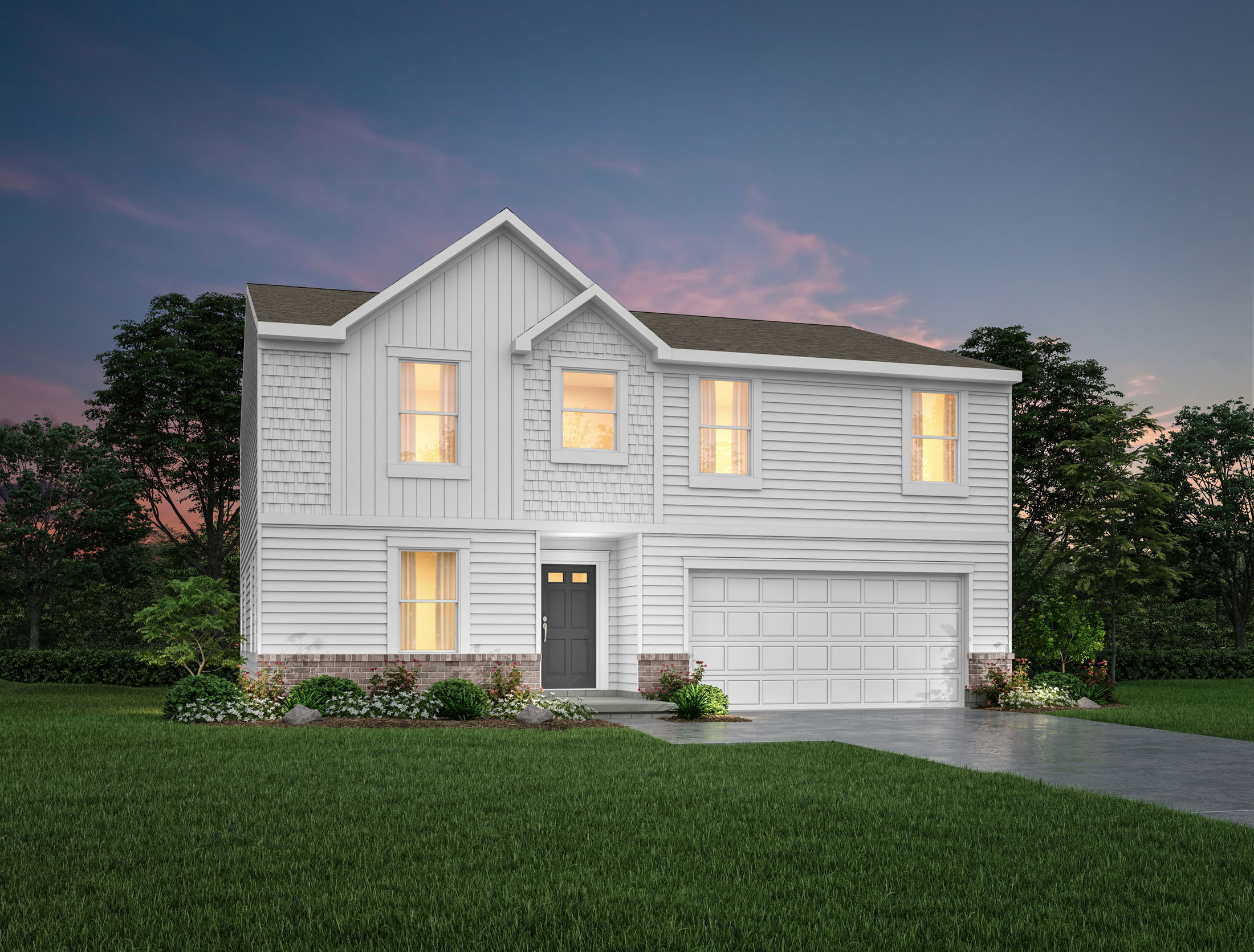 Modern two-story white house with illuminated windows and attached garage set against a twilight sky.