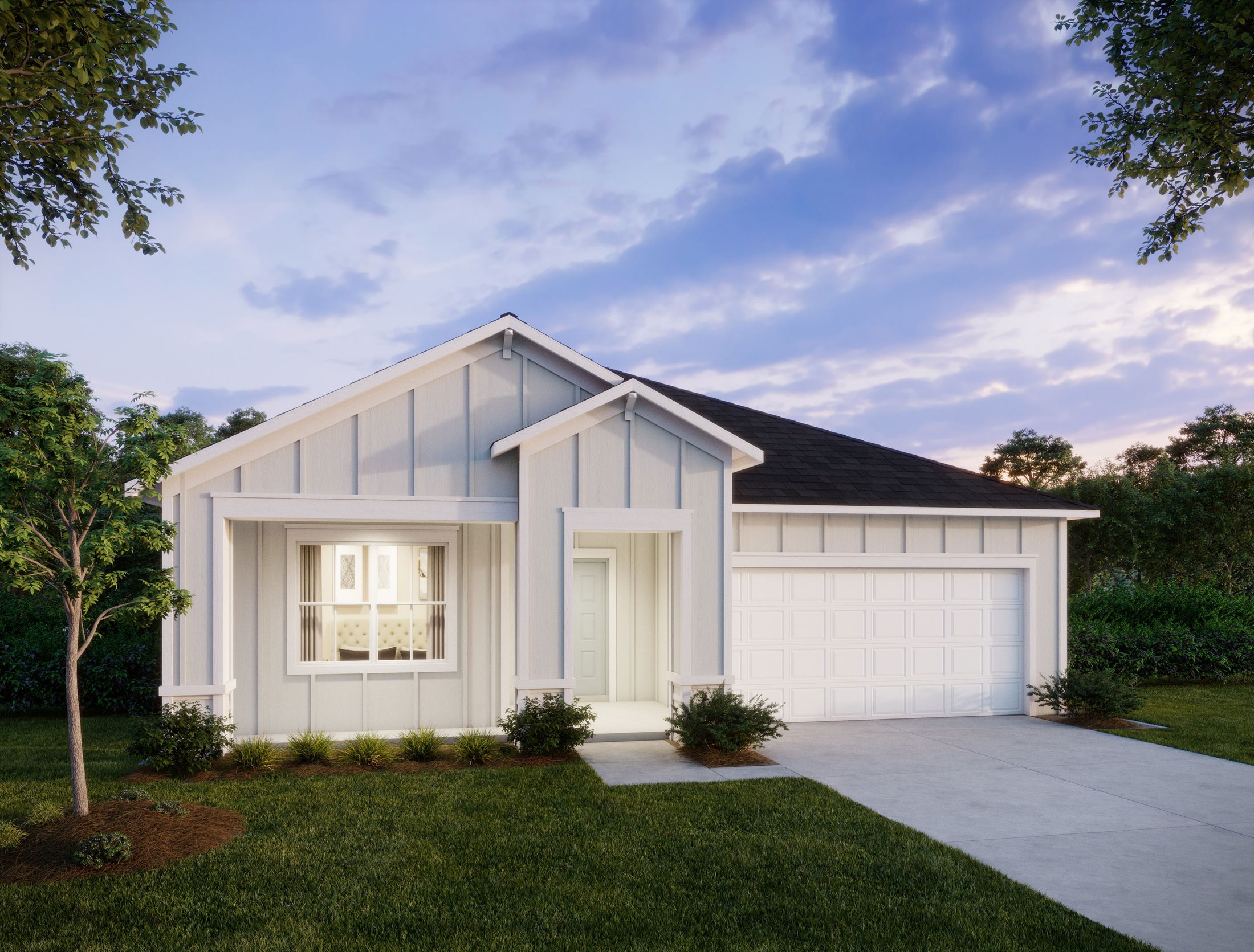 Modern single-story white house with a two-car garage in a suburban setting at sunset.