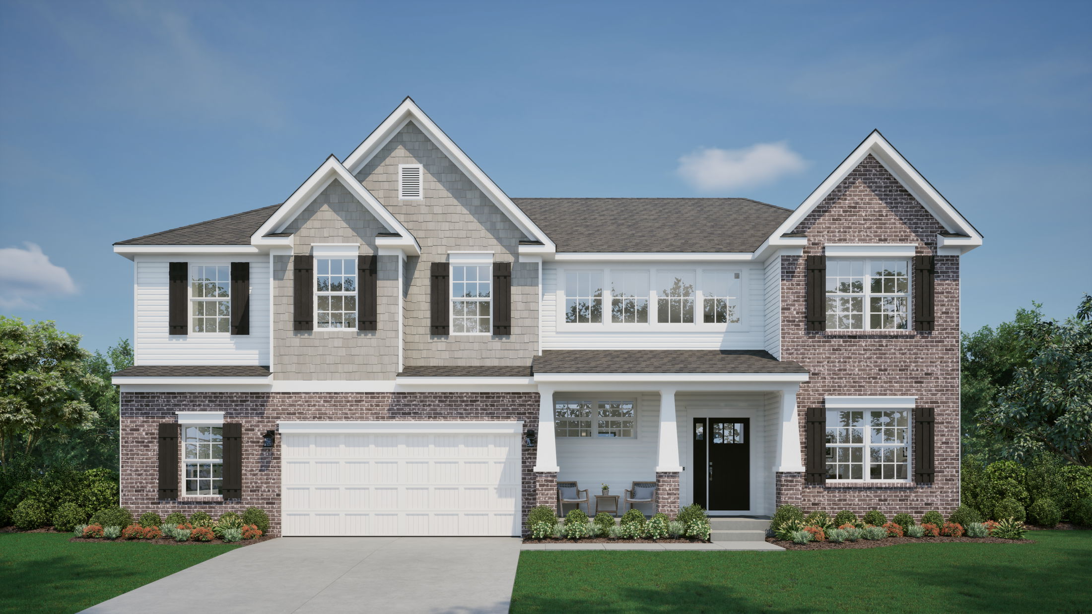 Modern two-story suburban home with brick and siding exterior, featuring a double garage and landscaped front yard.