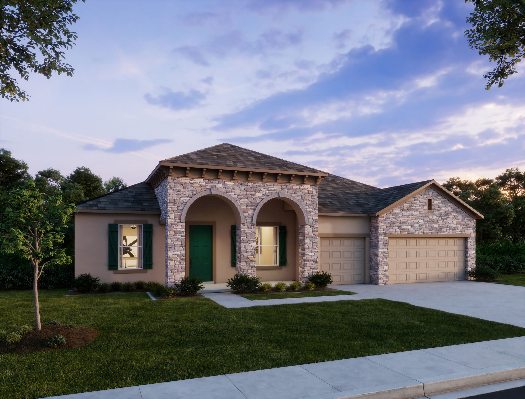 Modern suburban house with stone facade and arches under a blue sky at sunset.