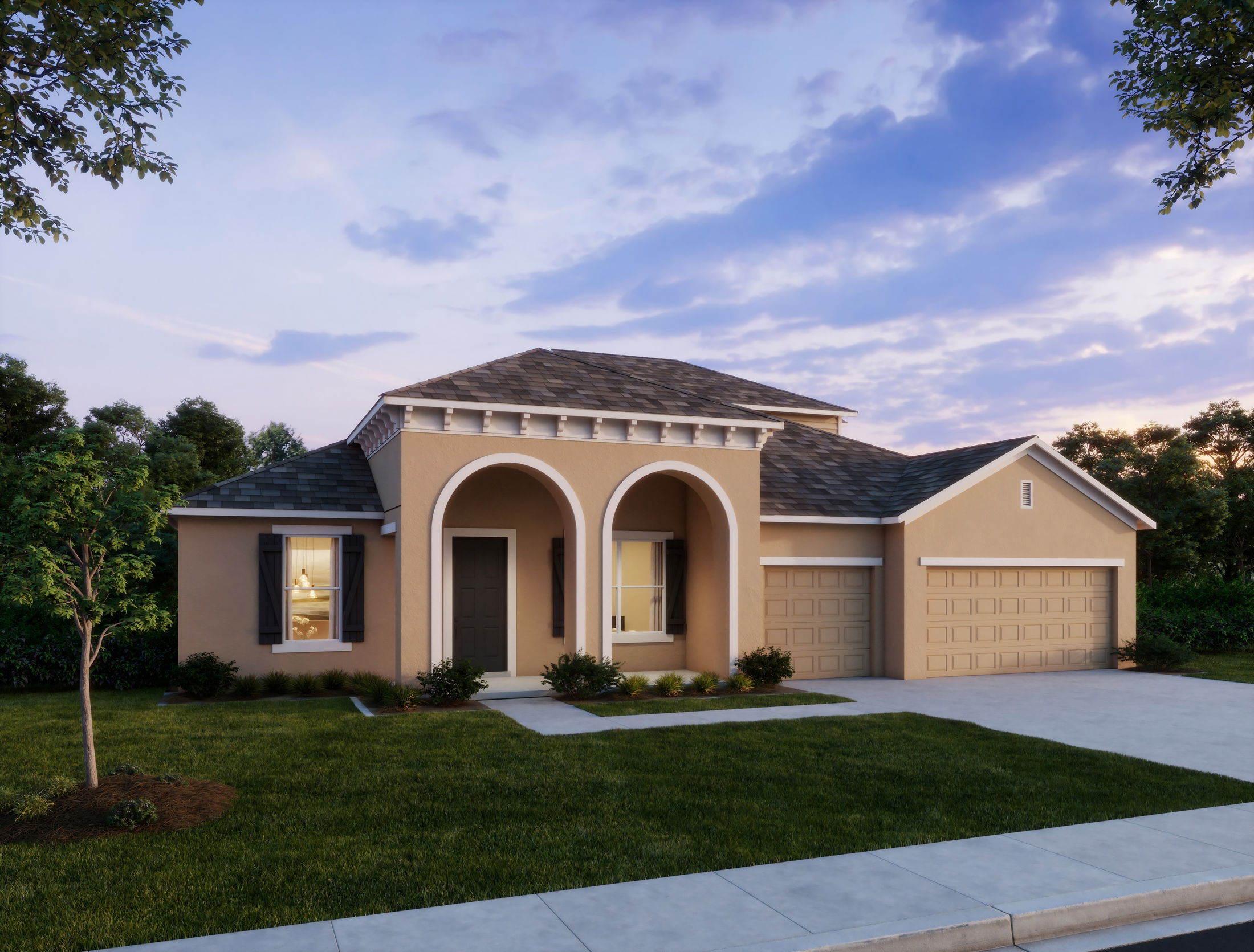 Modern single-story stucco house with two-car garage and well-maintained front lawn at sunset.