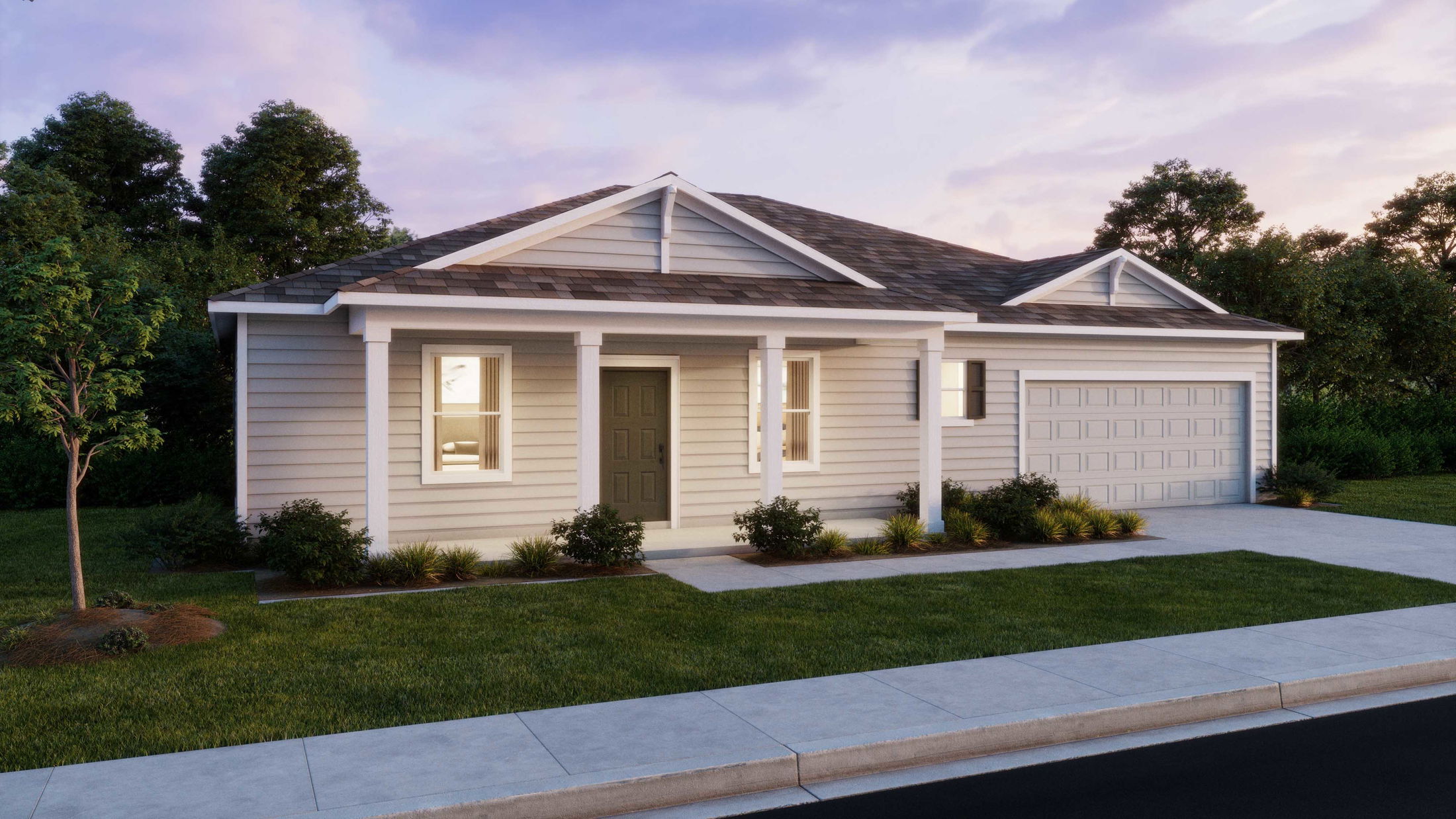 Single-story suburban house with a two-car garage, front porch, and landscaped yard at sunset.