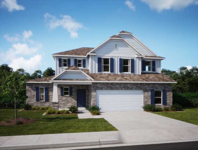 Two-story house with a combination of brick and siding exterior, a gabled roof, and a two-car garage, set against a clear blue sky.