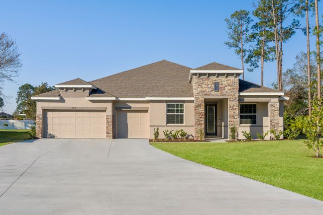 Single-story modern suburban home with a stone-accented facade and a spacious three-car garage.