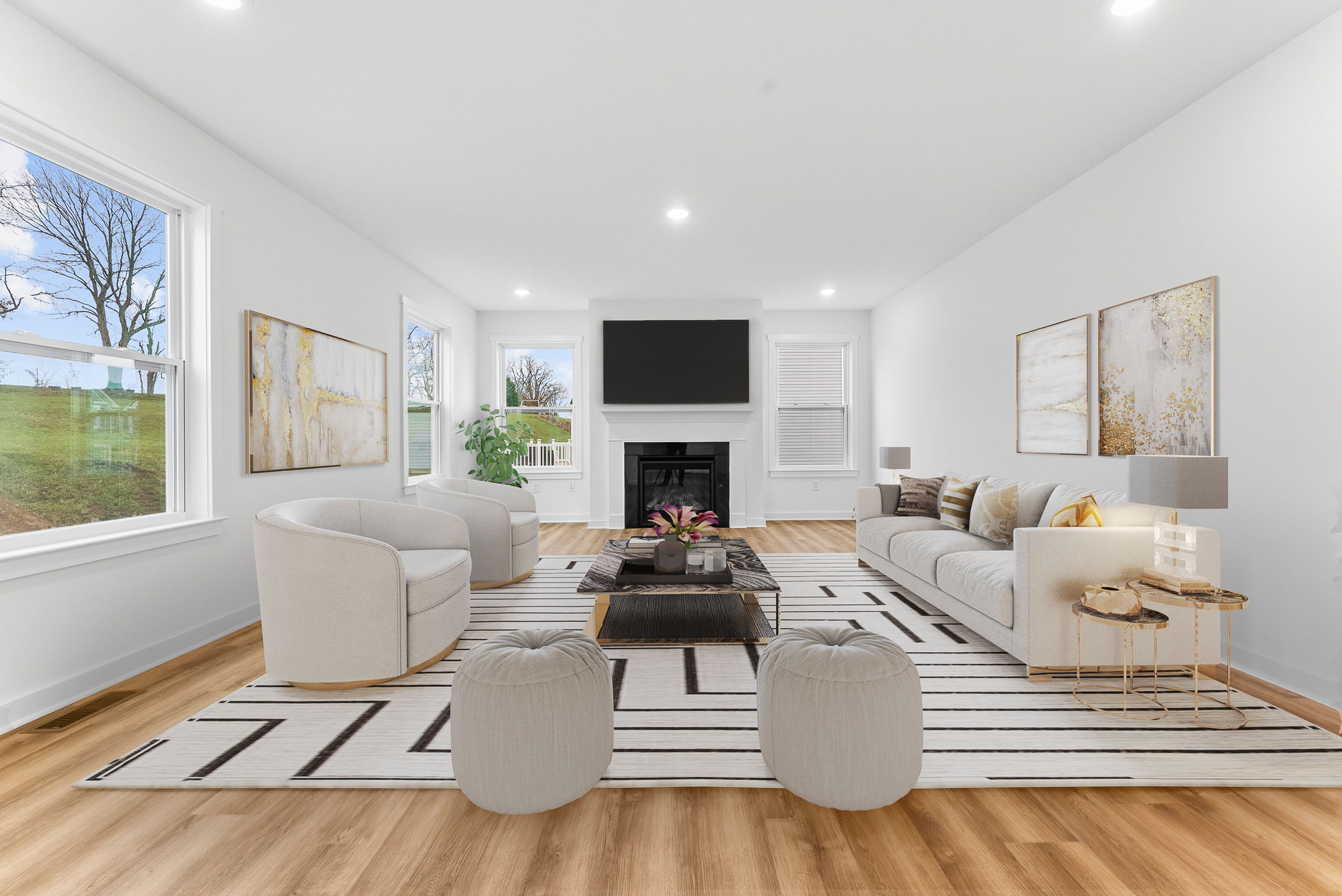 Elegant modern living room with neutral furniture, large windows, a stylish fireplace, and contemporary decor on wooden flooring.