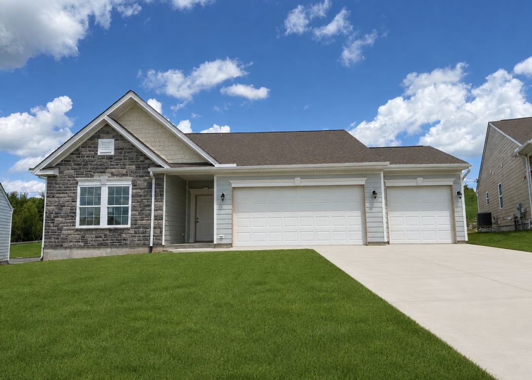 A modern single-story house with stone accents and a three-car garage, set against a blue sky with white clouds.