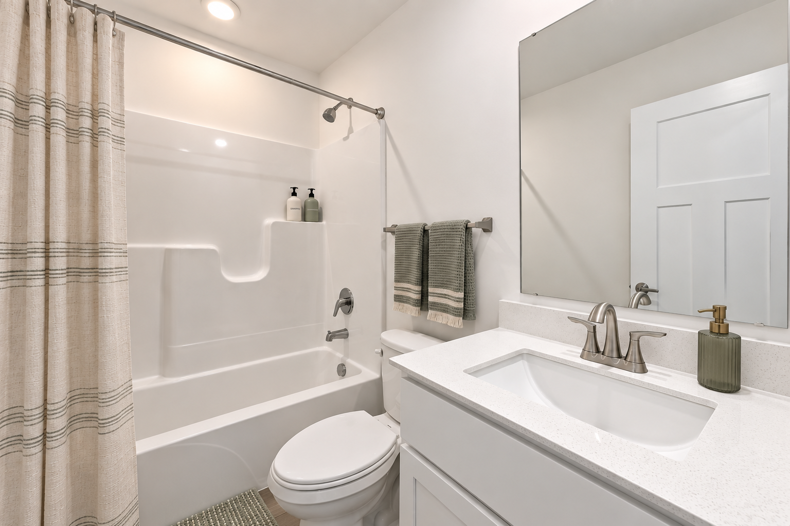 Modern bathroom featuring a bathtub, shower curtain, sink with faucet, and a mirror.