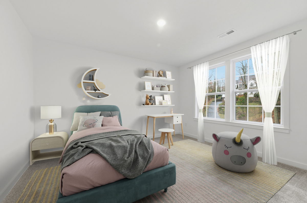 Bright and cheerful child's bedroom with a teal bed, space-themed decor, and a whimsical unicorn pouf.