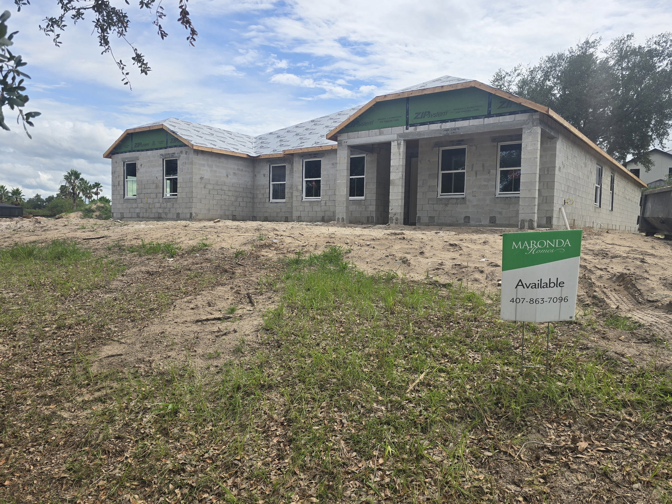 Newly constructed house for sale by Maronda Homes with a sign indicating availability, set on a freshly graded lot.