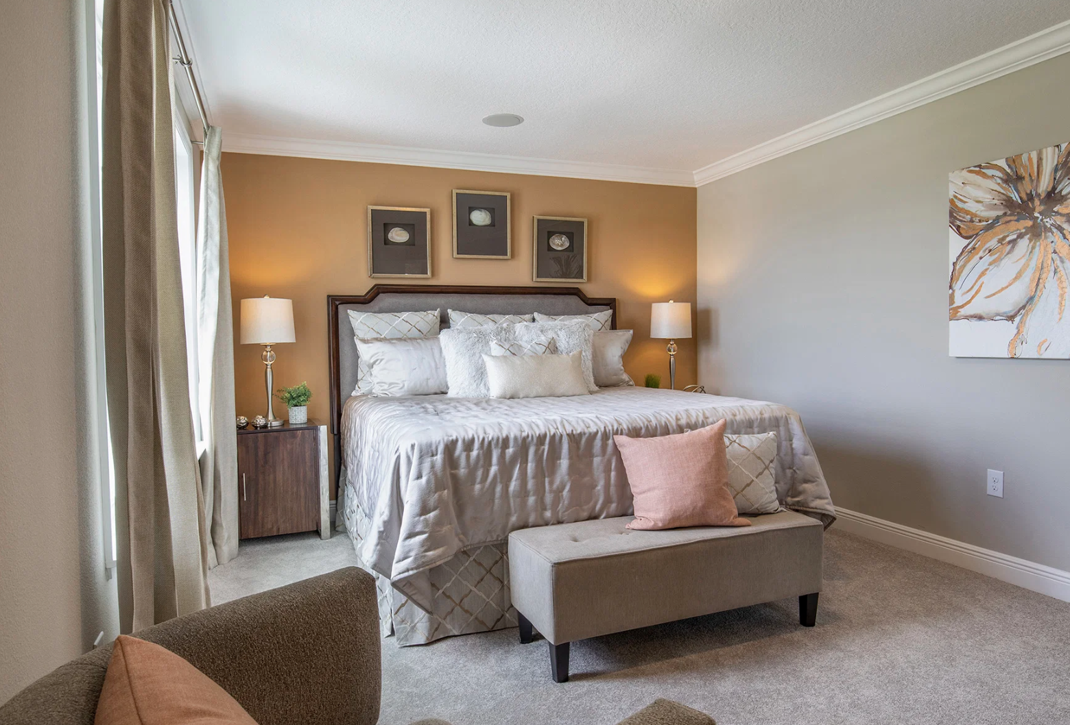 Stylish modern bedroom featuring a plush bed, elegant decor, and soft lighting, perfect for relaxing retreats.