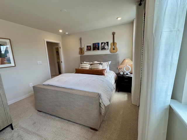 Stylish bedroom with a cozy bed, wall-mounted guitars, and modern decor accents.