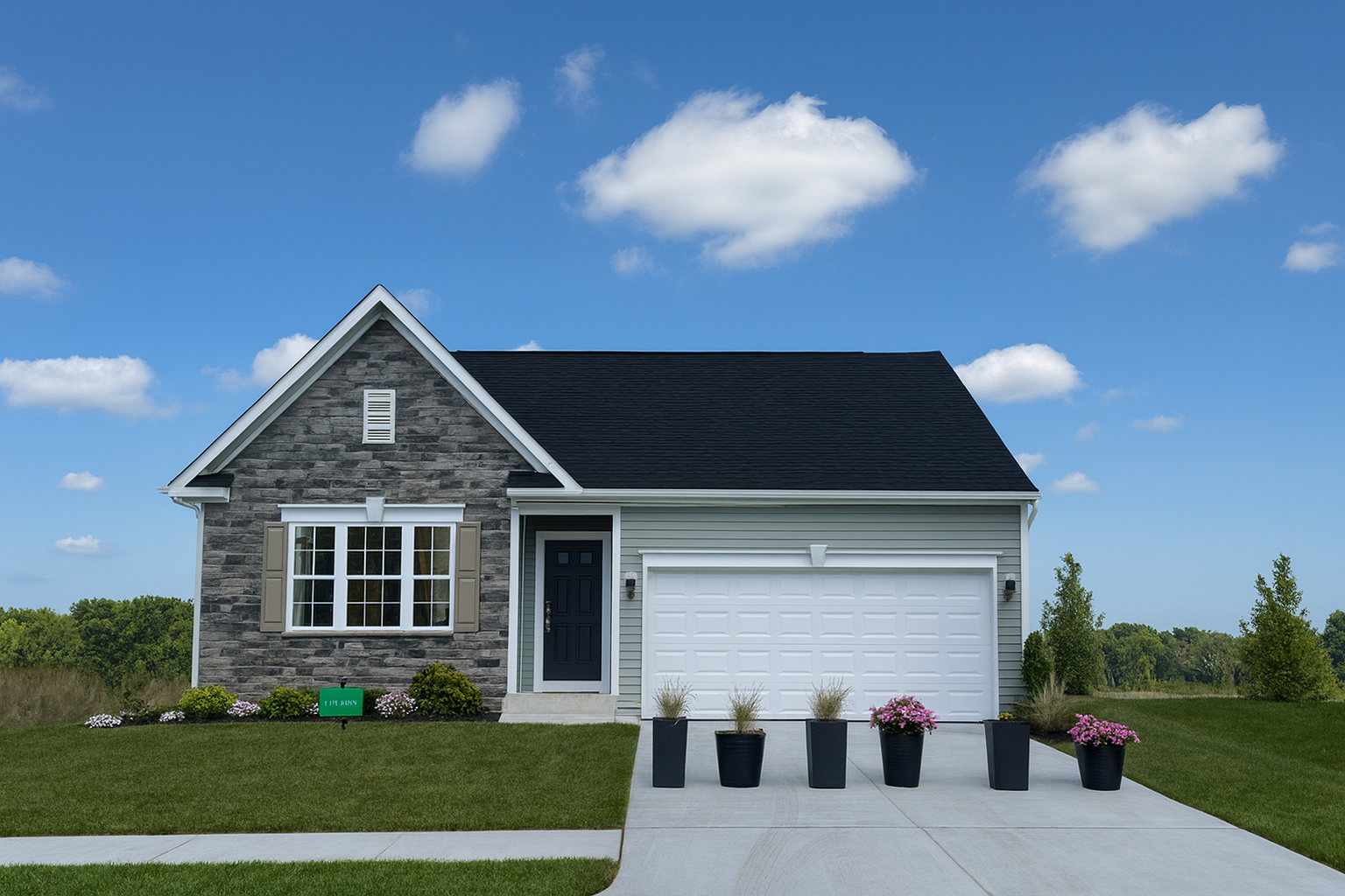 Modern suburban house with a stone facade, black roof, white garage door, and landscaped front yard under a clear blue sky.